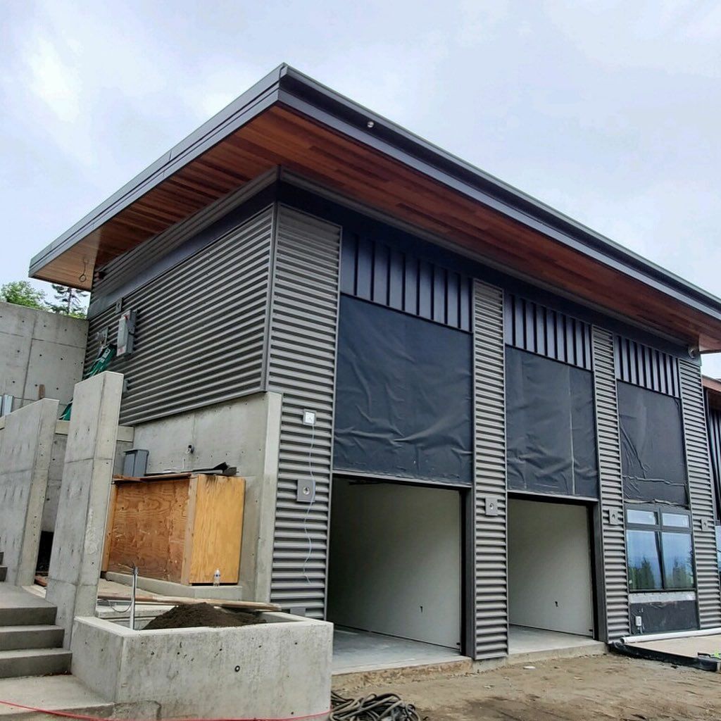 A large building with a wooden roof and custom siding